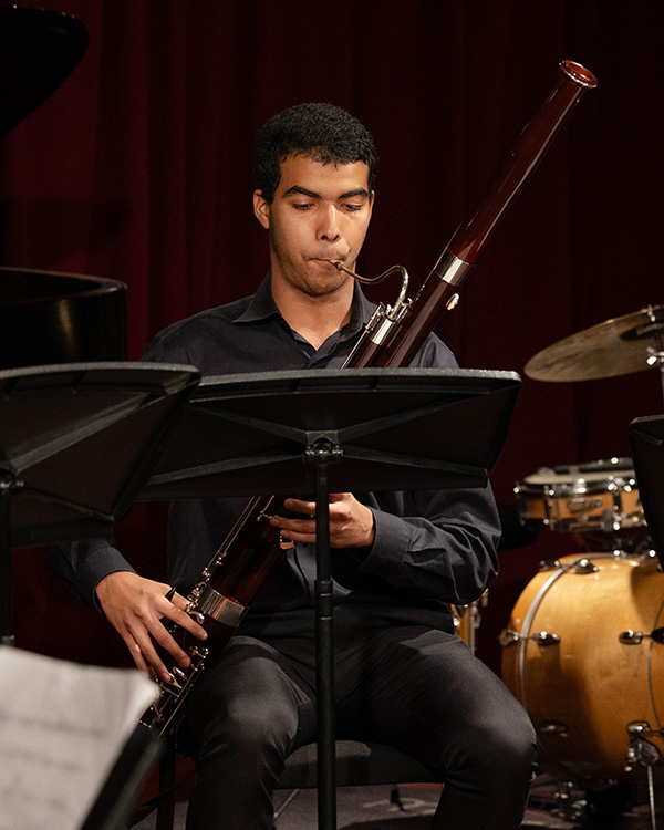 Teenage boy playing bassoon