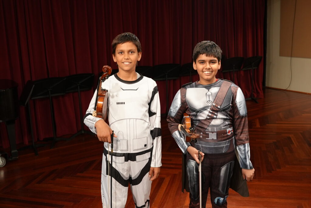 Spooky Suzuki violin students in their costumes.