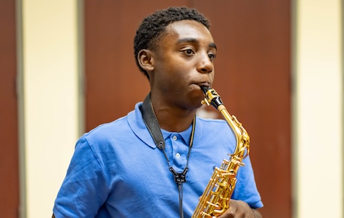 Levine Honors student playing the saxophone