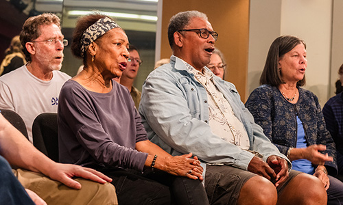 Adults singing together.